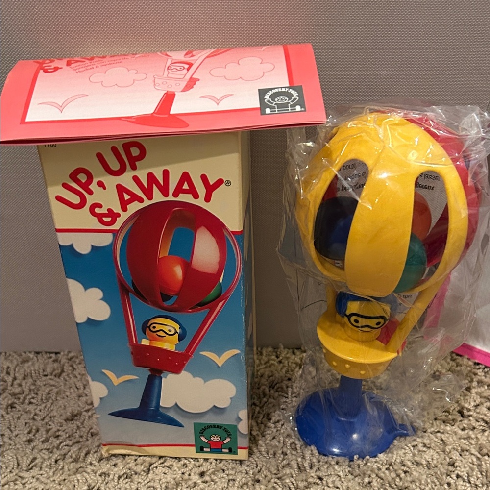 Up, Up & Away Spinning Balloon Toy - Red, Yellow, and Blue